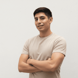 Kai Perez standing with arms crossed.